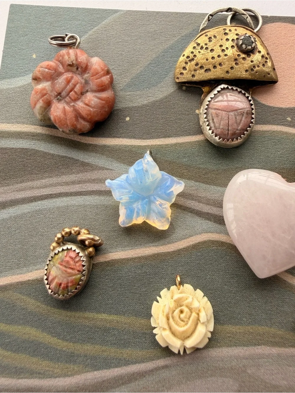 Vintage and handmade whimsical charms, pendants stones.